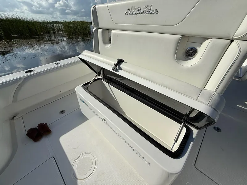 Slide: The Image of 2023 SeaHunter 28 Floridian boat with open storage compartment, showcasing sleek design and functionality. - 29
