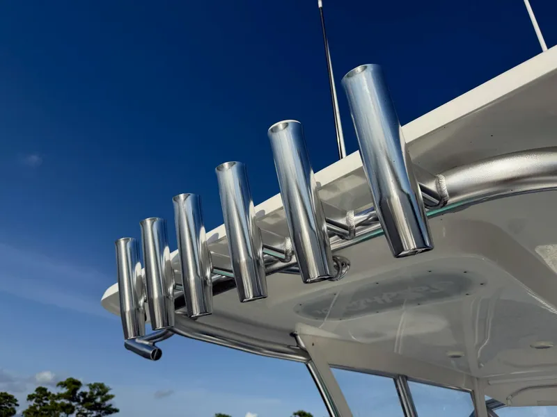 Slide: The Image of Rod holders on a 2023 SeaHunter 28 Floridian boat against a clear blue sky. - 40