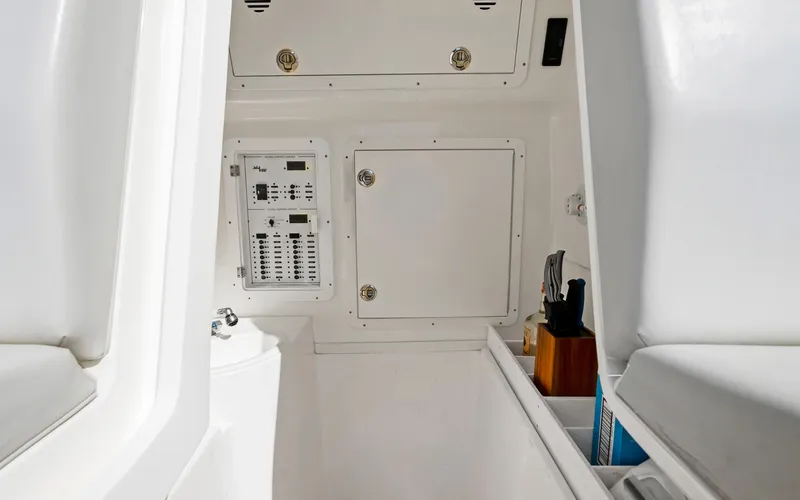 Slide: The Image of 2019 SeaVee 390Z interior cabin with control panel and storage compartments. - 16