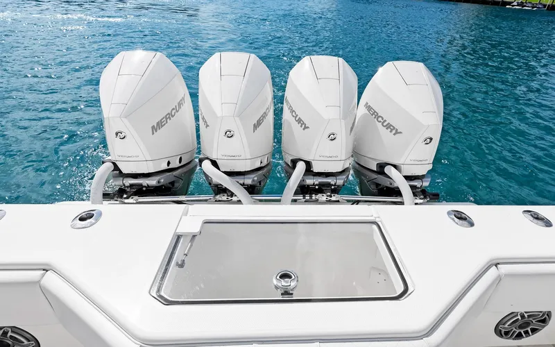 Slide: The Image of 2019 SeaVee 390Z boat with four Mercury outboard engines on blue water. - 25