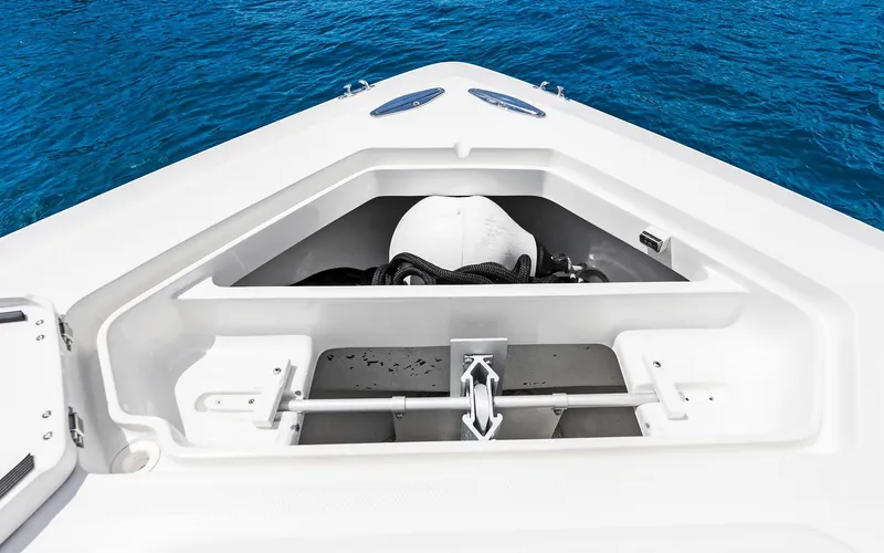 Slide: The Image of 2019 SeaVee 390Z boat anchor compartment with ocean background. - 27