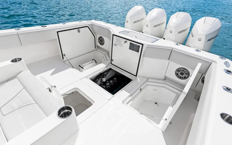 Slide: The Image of 2019 SeaVee 390Z boat deck with storage compartments and Mercury engines. - 31