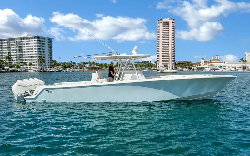Slide: The Image of 2019 SeaVee 390Z boat on water with cityscape background. - 4