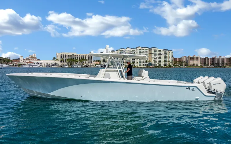 Slide: The Image of 2019 SeaVee 390Z boat on water with cityscape background. - 6