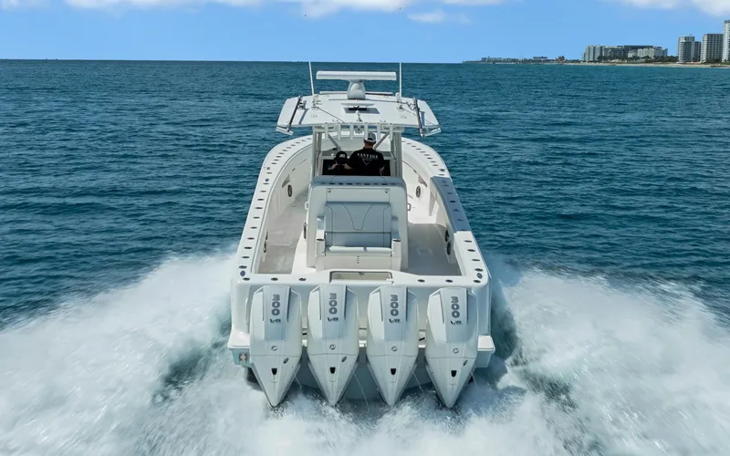 Slide: The Image of 2019 SeaVee 390Z boat with four engines cruising on open water. - 9