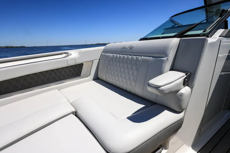 Slide: The Image of 2023 Sea Ray SLX 310 Outboard boat interior with luxurious seating and armrest. - 10