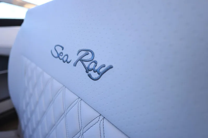 Slide: The Image of Close-up of 2023 Sea Ray SLX 310 Outboard seat with embroidered logo. - 18