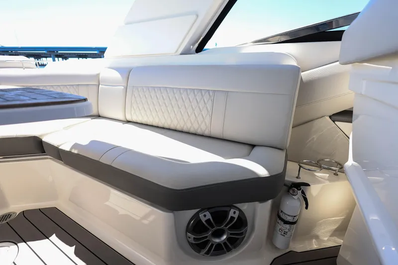 Slide: The Image of Luxurious seating area on 2023 Sea Ray SLX 310 Outboard boat, featuring elegant upholstery and modern design. - 30