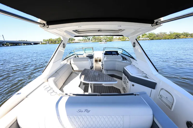Slide: The Image of 2023 Sea Ray SLX 310 Outboard luxury boat interior on a sunny day. - 33