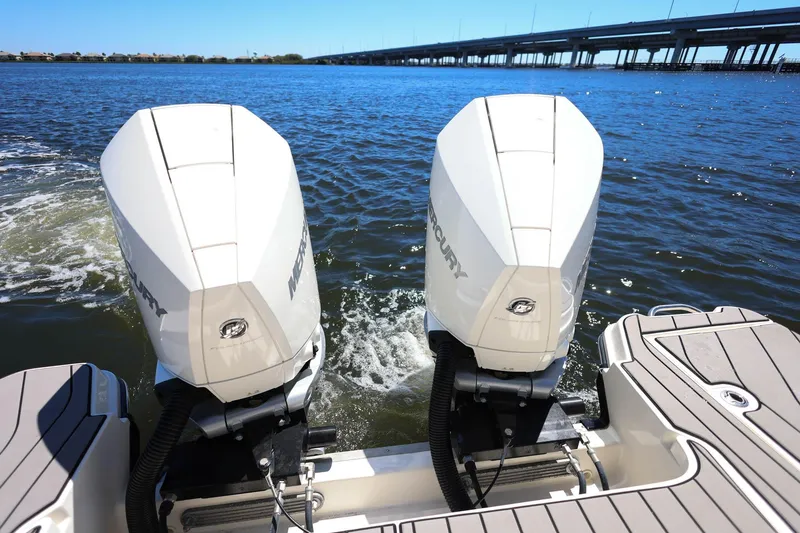 Slide: The Image of 2023 Sea Ray SLX 310 Outboard with twin Mercury engines on water. - 34