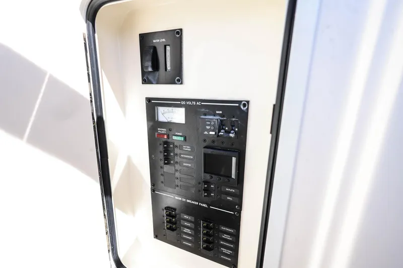 Slide: The Image of Electrical control panel on 2023 Sea Ray SLX 310 Outboard boat. - 36