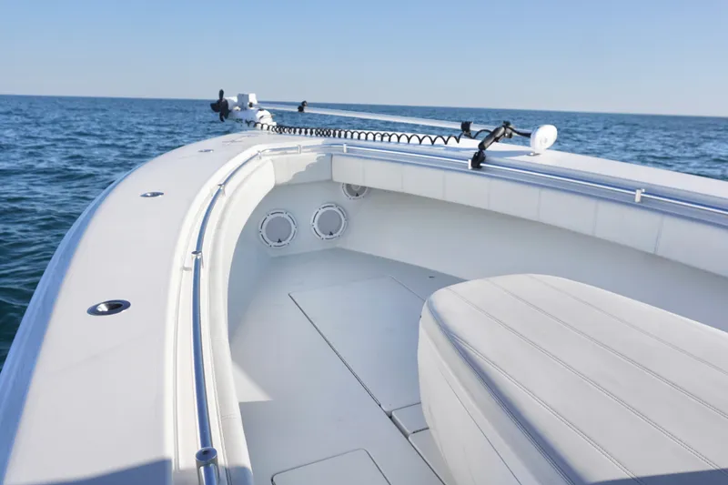 Slide: The Image of 2021 Contender 32 ST boat on open water, showcasing sleek design and spacious deck. - 15