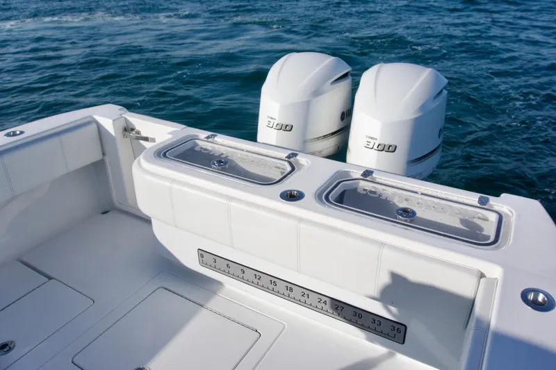 Slide: The Image of 2021 Contender 32 ST boat with dual Yamaha 300 engines on open water. - 9