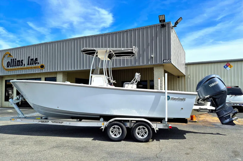 The Image of 2026 May-Craft 245 Offshore CC boat on trailer outside Collins Inc. building. - 0