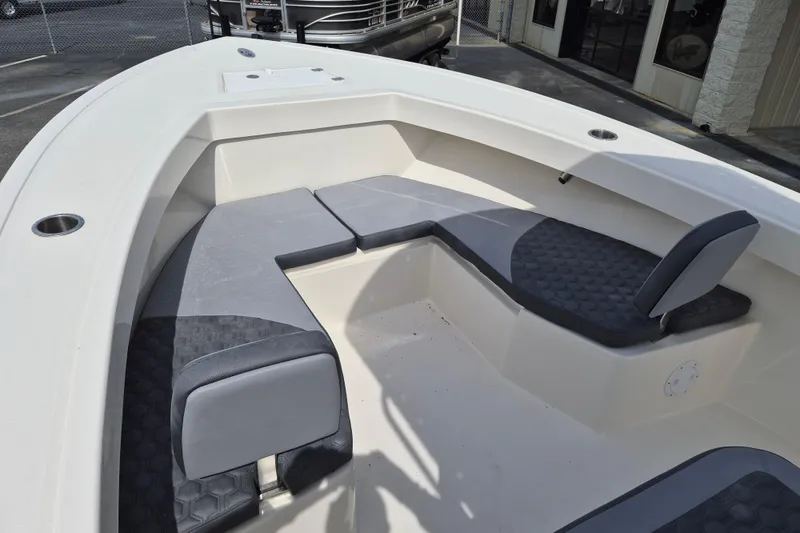 Slide: The Image of 2026 May-Craft 245 Offshore CC boat interior with cushioned seating and modern design. - 12