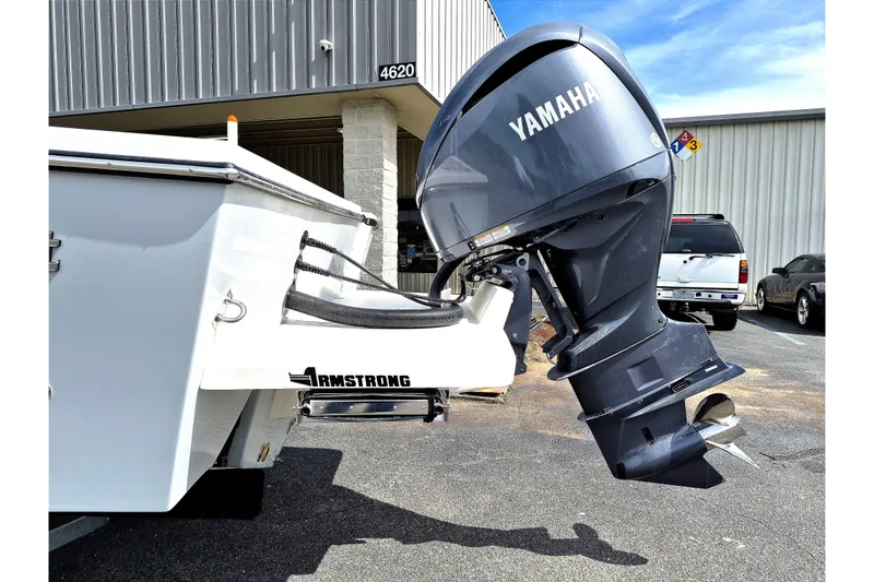 Slide: The Image of 2026 May-Craft 245 Offshore CC with Yamaha outboard motor in parking lot. - 3