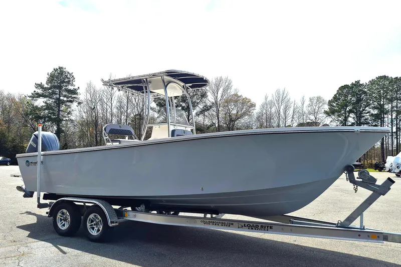 Slide: The Image of 2026 May-Craft 245 Offshore CC boat on trailer in outdoor setting. - 8