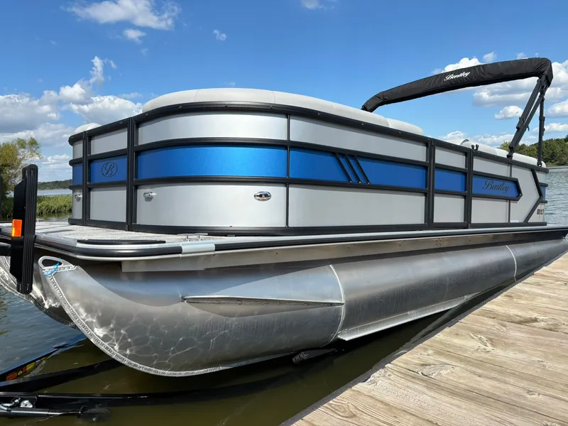 Slide: The Image of 2027 Bentley Pontoons 223 Bolt on a lake under sunny skies. - 39