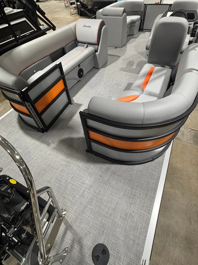Slide: The Image of Interior of Bentley Pontoons 223 Bolt 2027 with gray and orange seating. - 31