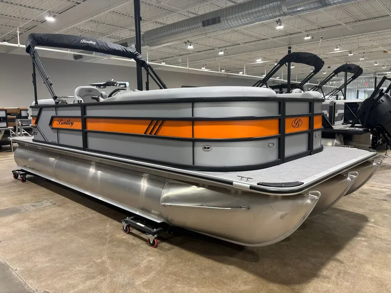 Slide: The Image of 2027 Bentley Pontoons 223 Bolt displayed in a showroom. - 4