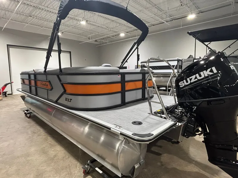 Slide: The Image of 2027 Bentley Pontoons 223 Bolt with Suzuki engine in a showroom. - 8