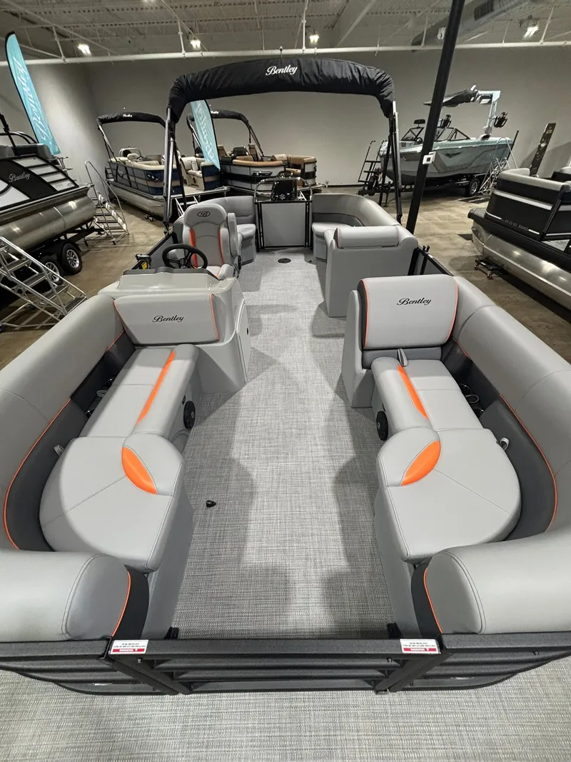 Slide: The Image of Interior view of 2027 Bentley Pontoons 223 Bolt with gray and orange seating. - 9