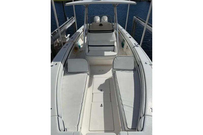 Slide: The Image of 2009 Intrepid 323 Open boat interior with white seating and open deck design. - 4