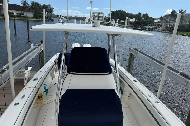 Slide: The Image of 2009 Intrepid 323 Open boat docked by a scenic waterfront. - 8