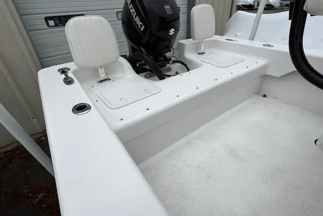 Slide: The Image of White 2021 Savannah SS19 boat interior with Suzuki outboard motor. - 12