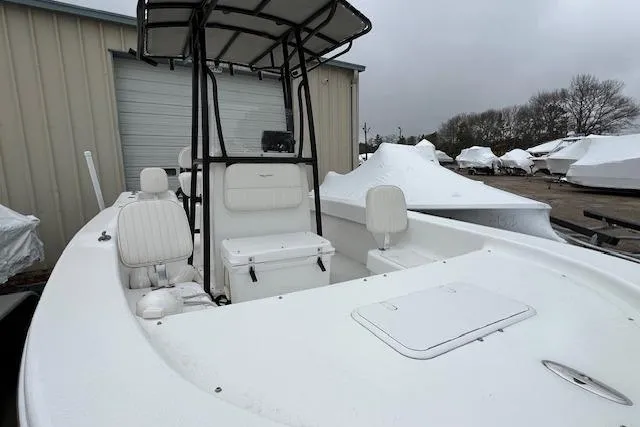 Slide: The Image of 2021 Savannah SS19 boat with T-top, white interior, and storage compartments. - 15