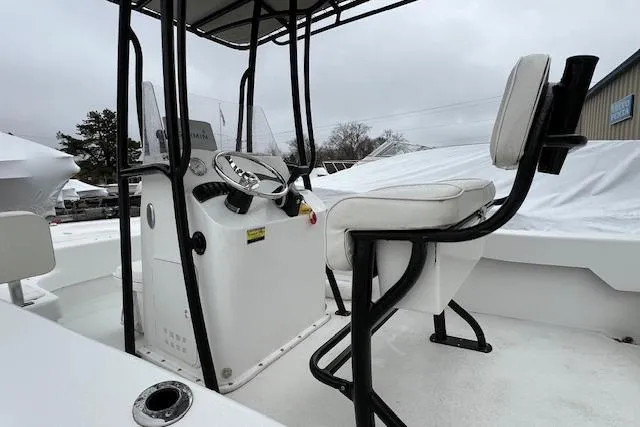Slide: The Image of Interior view of a 2021 Savannah SS19 boat with steering console and seating. - 4