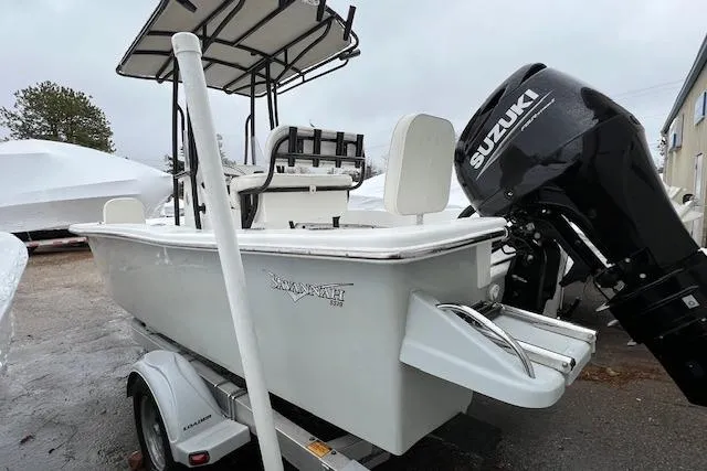 Slide: The Image of 2021 Savannah SS19 boat on trailer with Suzuki outboard motor. - 5