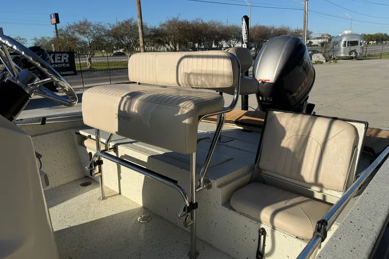 Slide: The Image of 2016 Xpress H20B Bay boat interior with seating and Yamaha 115 engine. - 6