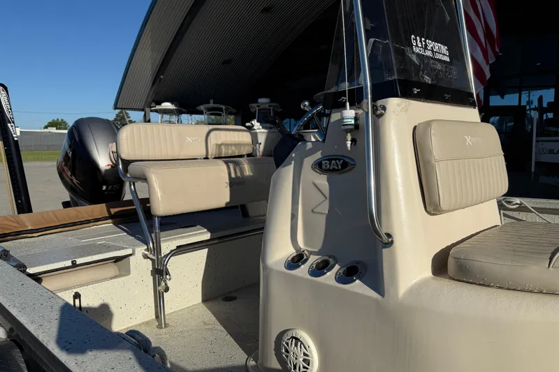 Slide: The Image of 2016 Xpress H20B Bay boat interior with seating and controls. - 8
