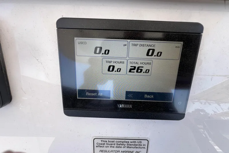 Slide: The Image of Yamaha display on 2023 Regulator 26XO showing trip and total hours. - 5