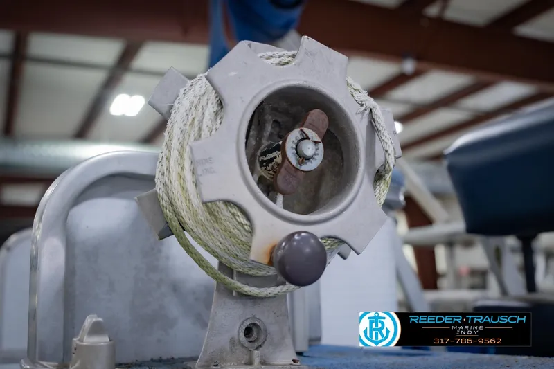 Slide: The Image of Close-up of a 1993 Godfrey SW 180 boat winch with rope in a workshop. - 38
