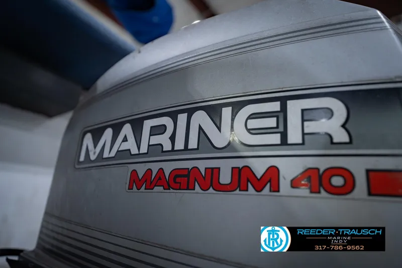 Slide: The Image of Mariner Magnum 40 outboard motor on 1993 Godfrey SW 180 boat. - 41