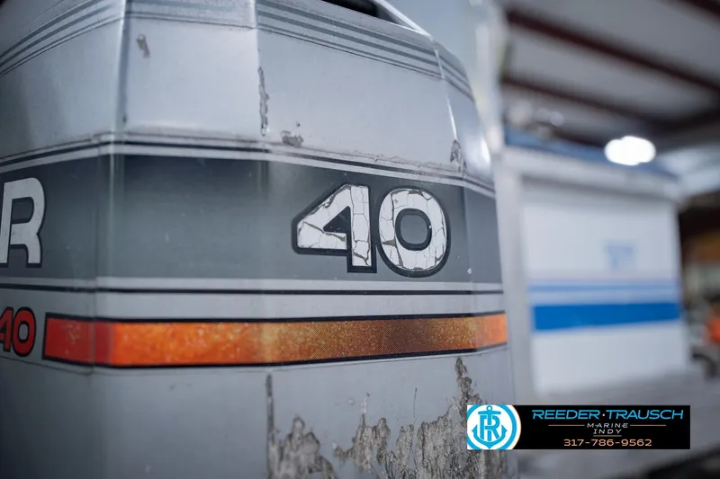 Slide: The Image of Close-up of a weathered Godfrey SW 180 boat engine from 1993. - 42