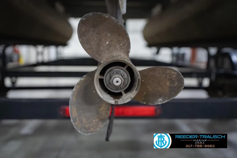 Slide: The Image of Propeller of a 1993 Godfrey SW 180 boat, displayed in a marine workshop. - 43