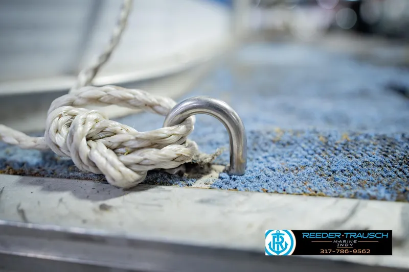 Slide: The Image of Rope tied to metal cleat on 1993 Godfrey SW 180 boat deck. - 47