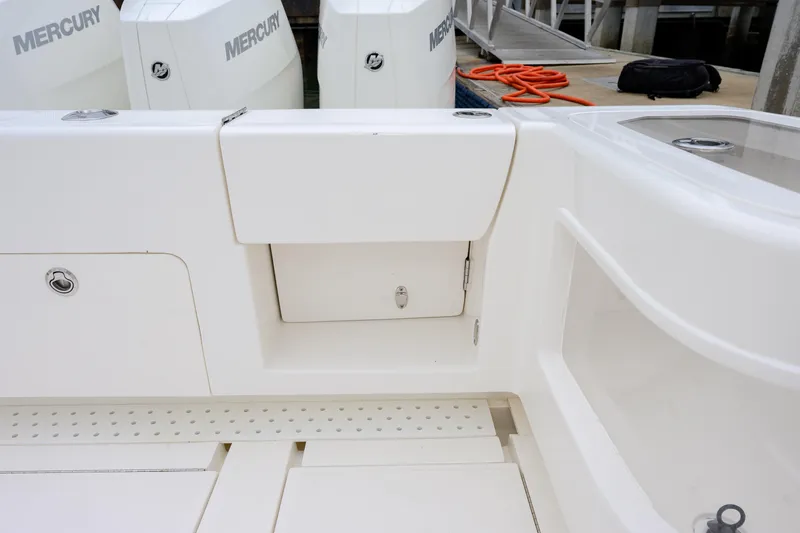 Slide: The Image of 2025 SeaVee 370Z boat deck with Mercury engines and storage compartments. - 10