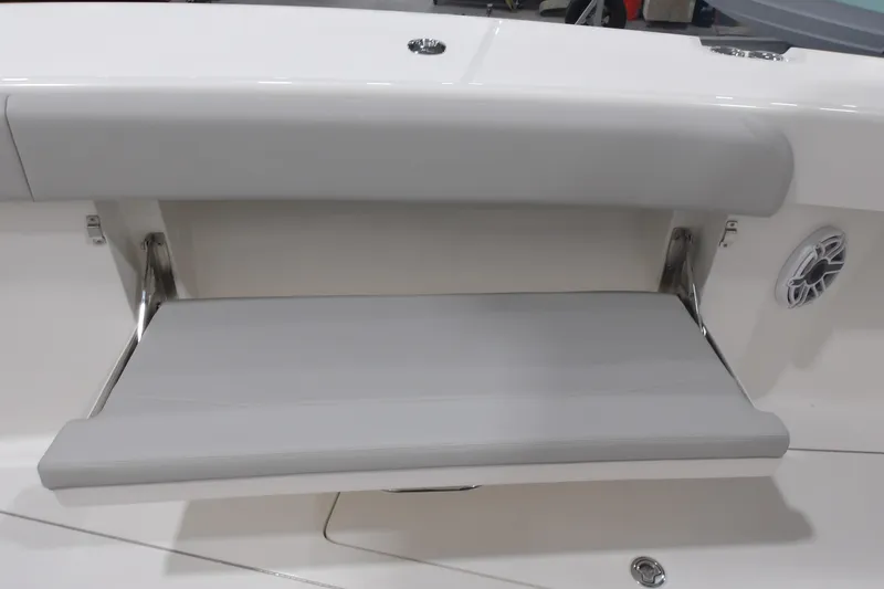 Slide: The Image of 2025 SeaVee 370Z boat with a foldable gray bench seat and speaker. - 5