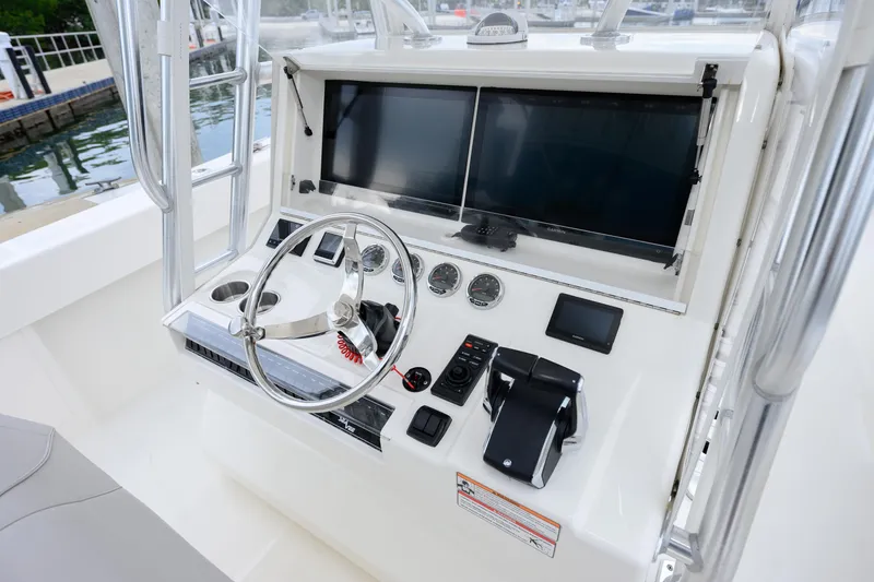 Slide: The Image of 2025 SeaVee 370Z boat helm with dual screens and modern controls. - 6