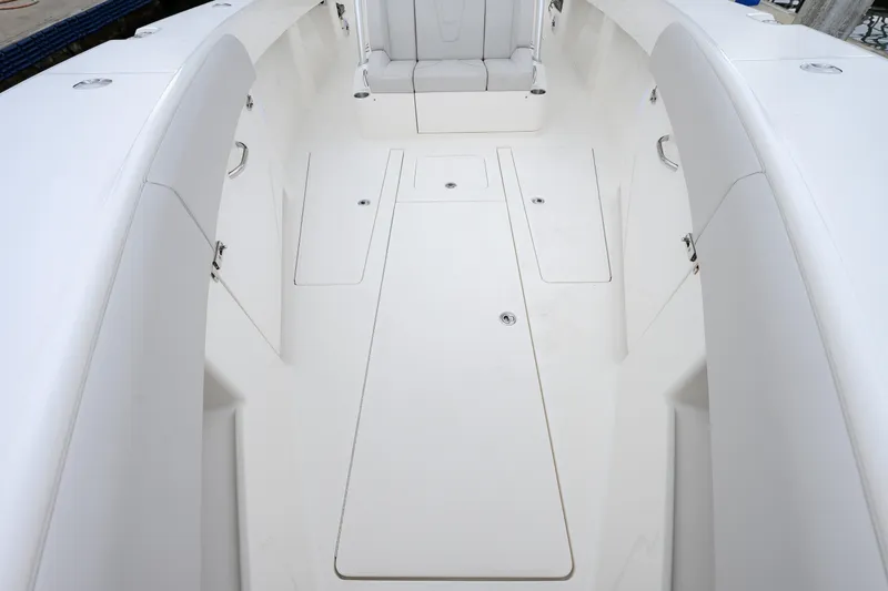 Slide: The Image of 2025 SeaVee 370Z boat interior with white seating and storage compartments. - 8