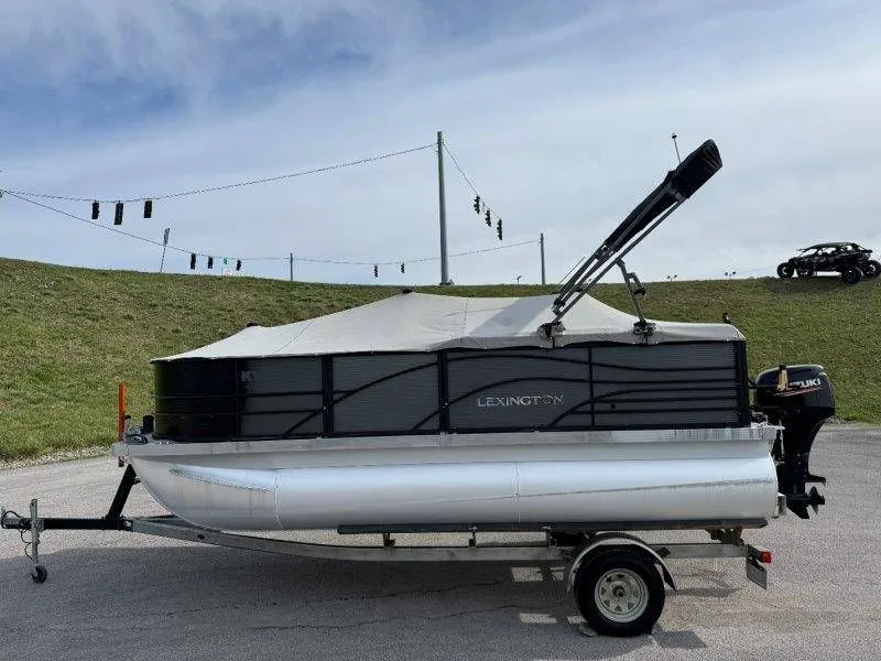 Slide: The Image of 2018 Lexington 5 Series pontoon boat on trailer. - 13