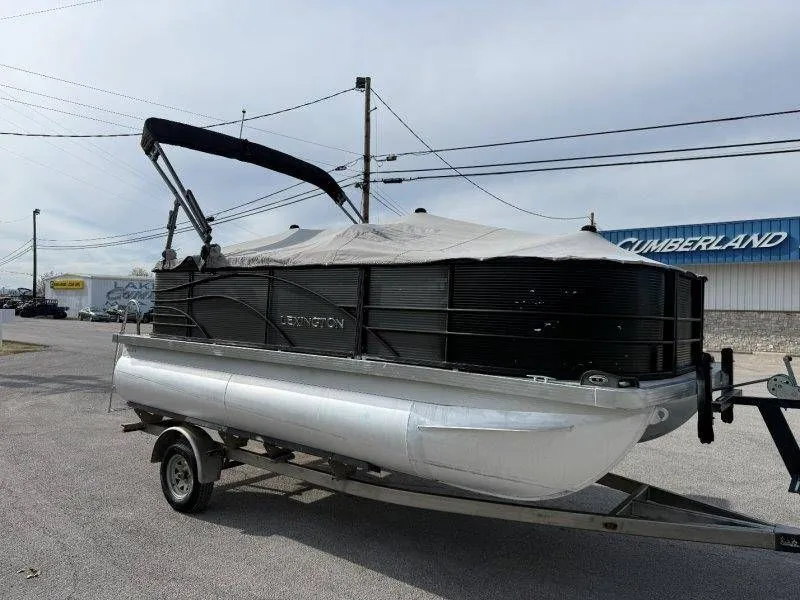 Slide: The Image of 2018 Lexington 5 Series pontoon boat on trailer. - 14