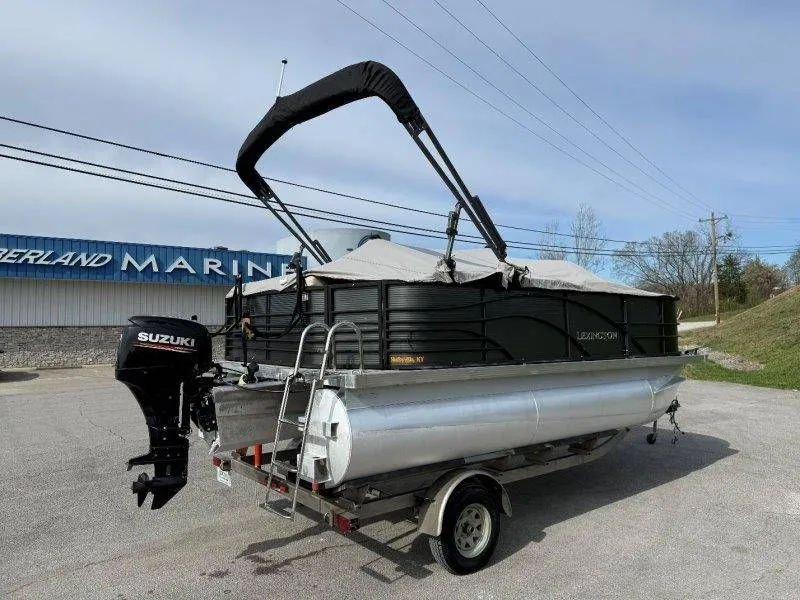 Slide: The Image of 2018 Lexington 5 Series pontoon boat with Suzuki motor on trailer. - 15