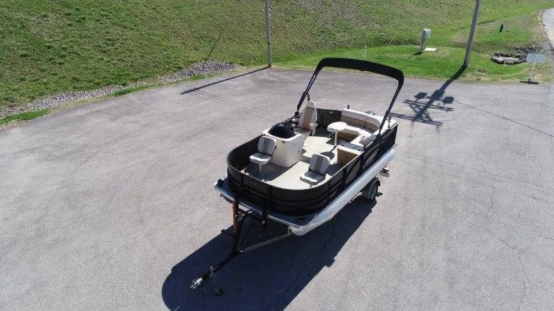 Slide: The Image of Aerial view of a 2018 Lexington 5 Series pontoon boat on a trailer. - 41
