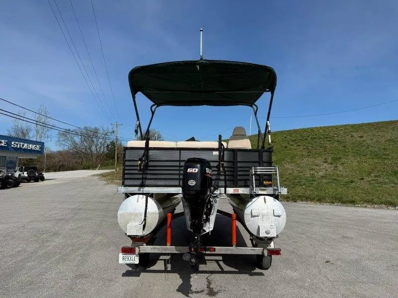 Slide: The Image of Rear view of a 2018 Lexington 5 Series pontoon boat on trailer. - 43