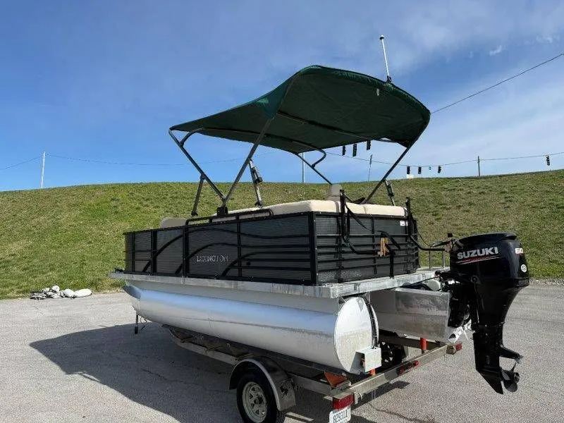 Slide: The Image of 2018 Lexington 5 Series pontoon boat with Suzuki outboard motor. - 47